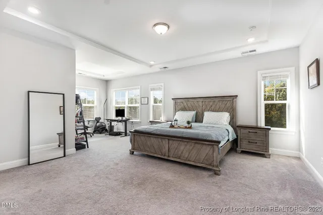 a bed room with a bed and window