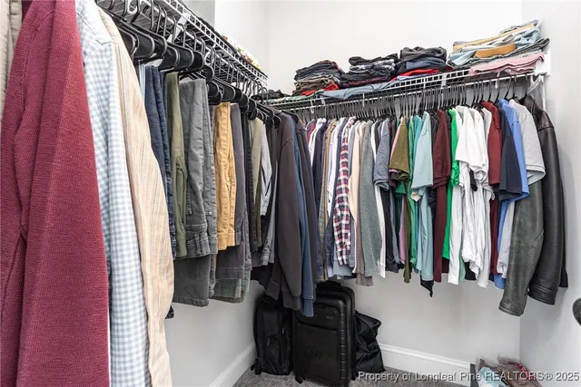 a living room with a large window and gym equipment