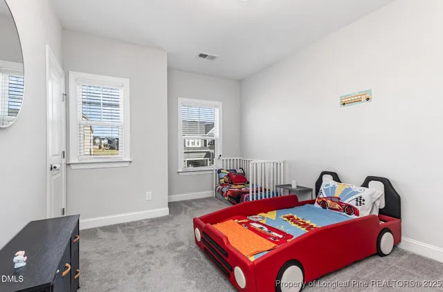 a bedroom with a bed and chair