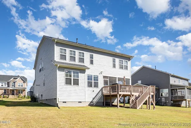 an aerial view of residential house with outdoor space and swimming pool
