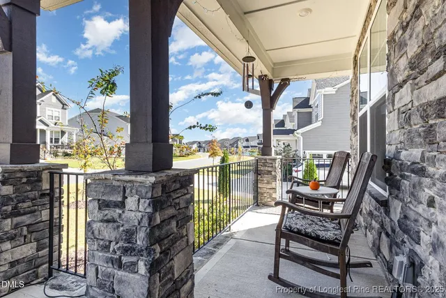 a balcony view with a couple of chairs