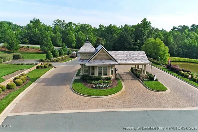 a view of a backyard with large trees