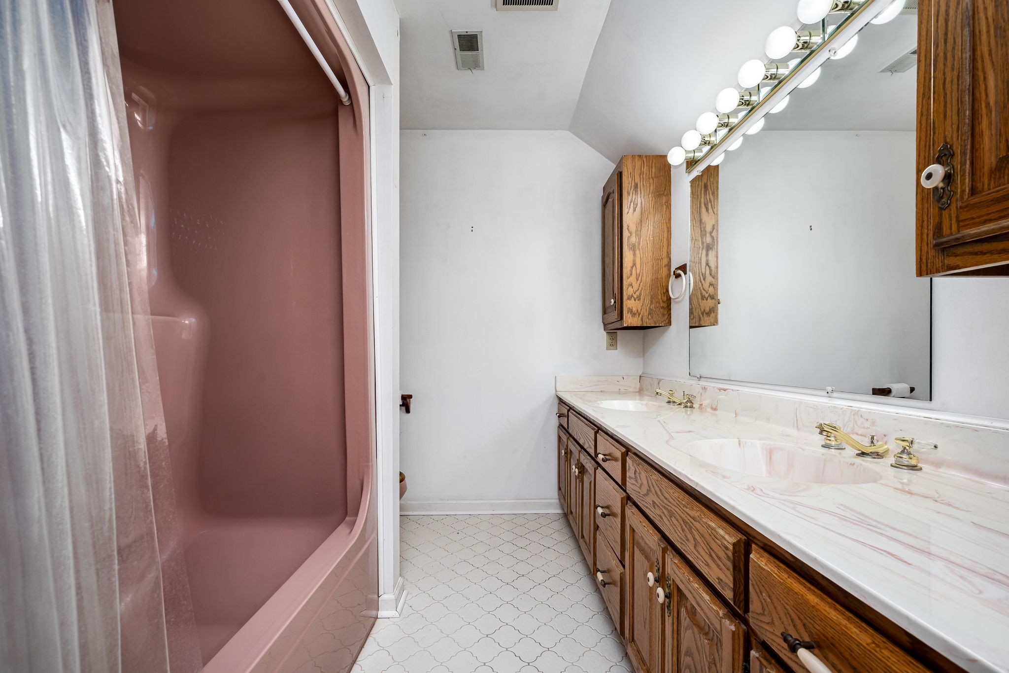 140 Motlow Road Tullahoma, TN 37388 - Photo 53 of 69 a bathroom with a double vanity sink and a mirror