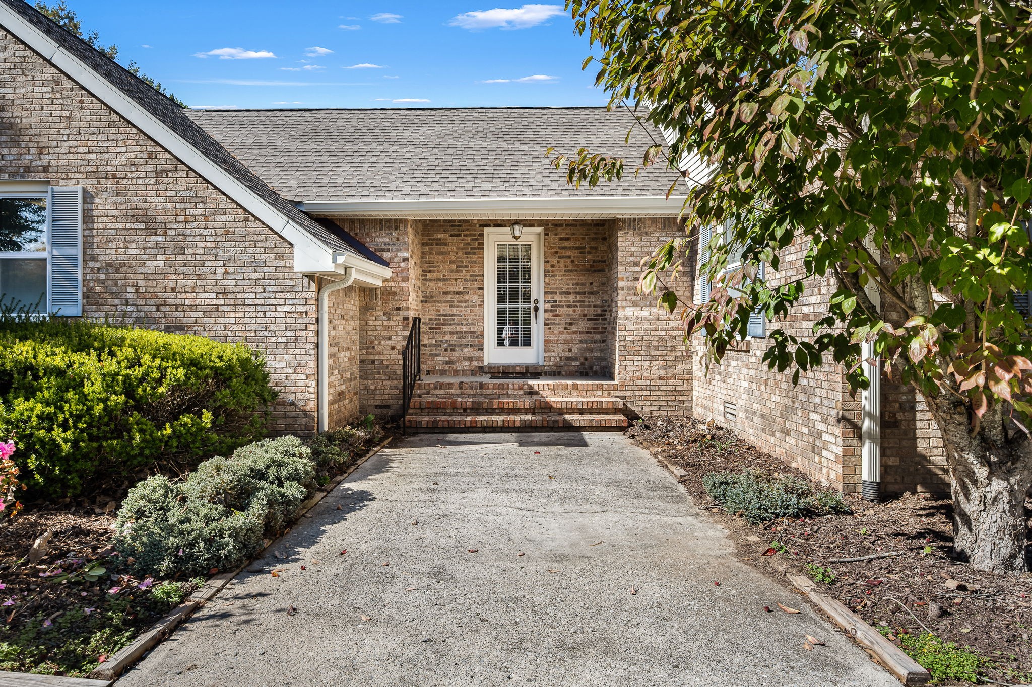 140 Motlow Road Tullahoma, TN 37388 - Photo 10 of 69 a front view of a house with a garden