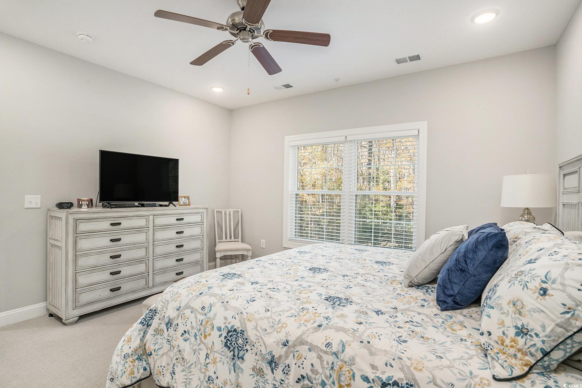 932 Jackline Place, Unit 101 Murrells Inlet, SC 29576 - Photo 18 of 40 Bedroom featuring light colored carpet, recessed lighting, and a ceiling fan