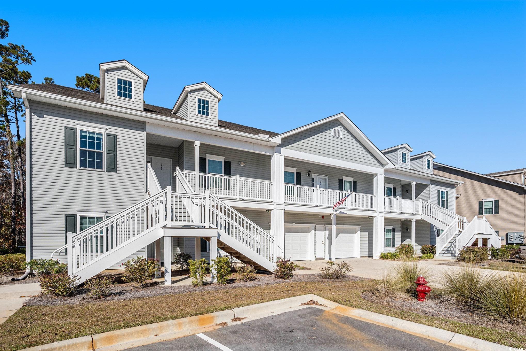 932 Jackline Place, Unit 101 Murrells Inlet, SC 29576 - Photo 33 of 40 View of building exterior featuring stairway