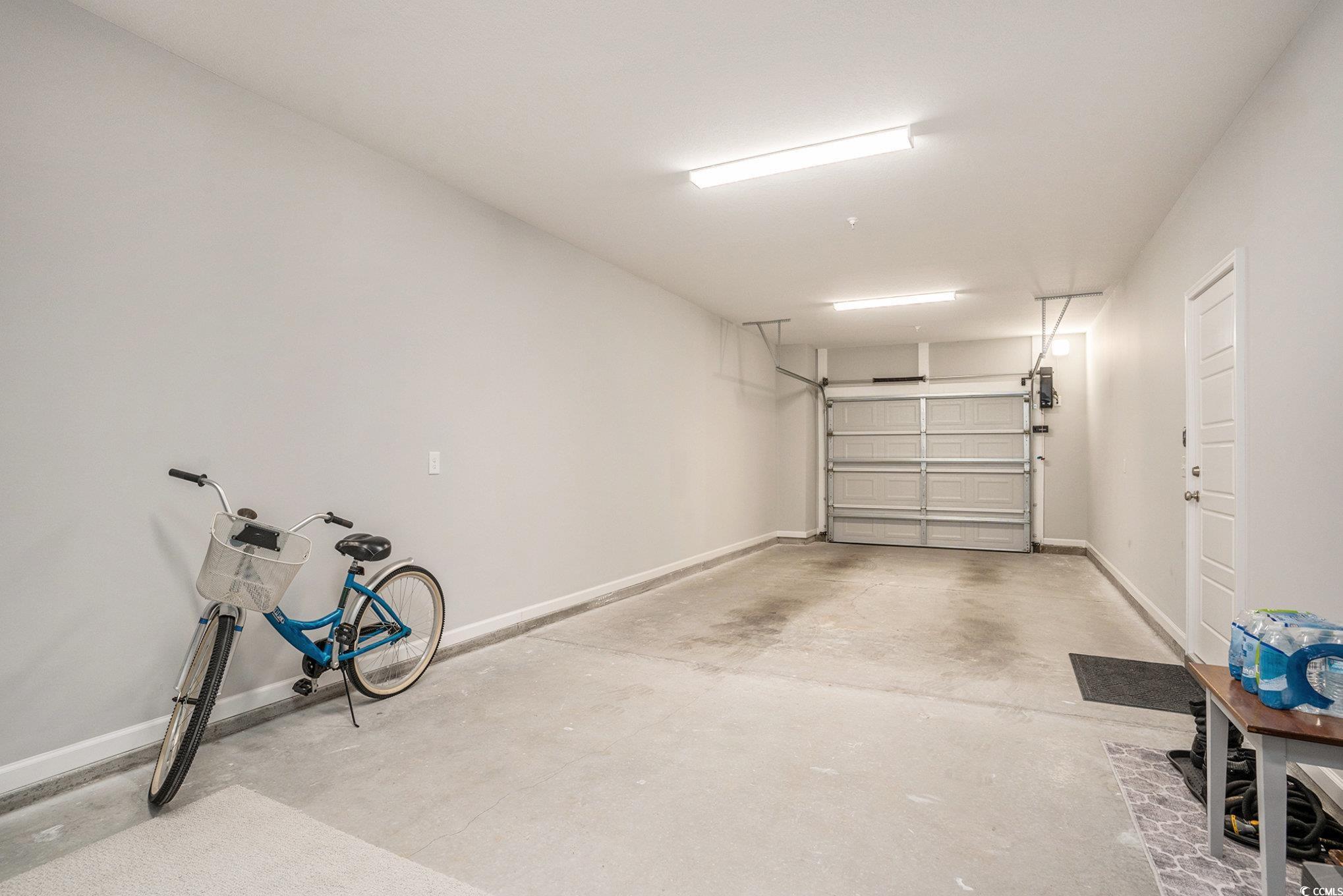 932 Jackline Place, Unit 101 Murrells Inlet, SC 29576 - Photo 4 of 40 Garage with baseboards
