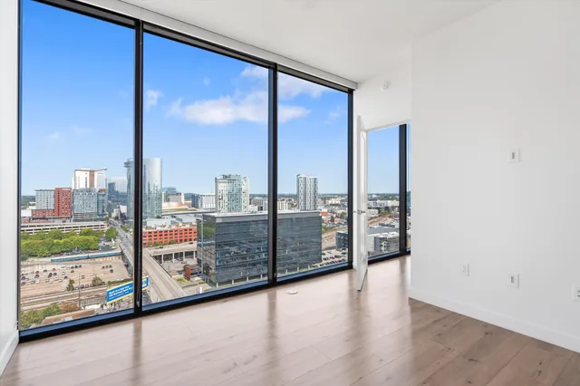 a view of a balcony with floor to ceiling window