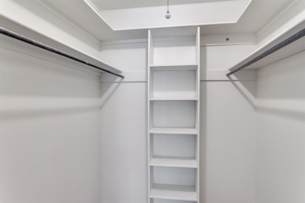 4022 Ridglea Country Club Drive, Unit 608 Fort Worth, TX 76126 - Photo 17 of 28 a view of walk in closet with empty racks