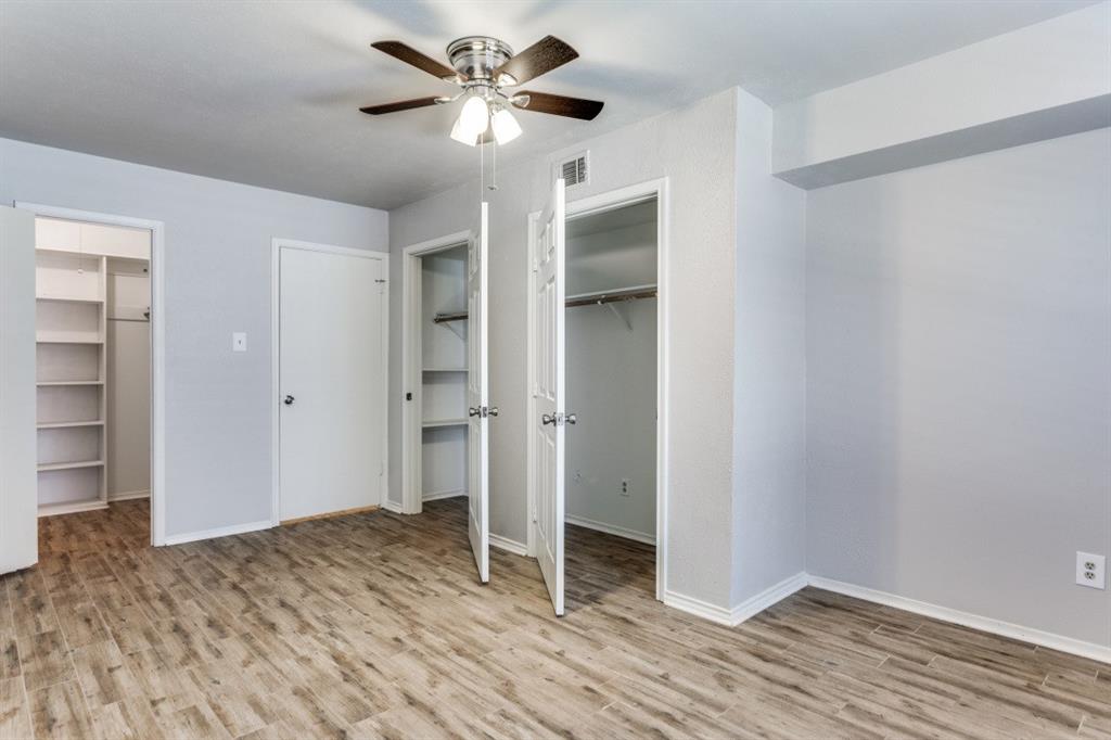 4022 Ridglea Country Club Drive, Unit 608 Fort Worth, TX 76126 - Photo 22 of 28 a view of empty room with wooden floor and ceiling fan