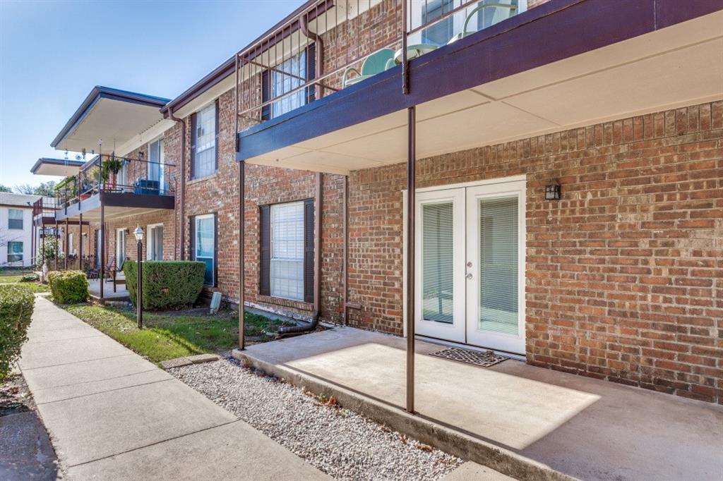 4022 Ridglea Country Club Drive, Unit 608 Fort Worth, TX 76126 - Photo 26 of 28 a view of a brick building with many windows