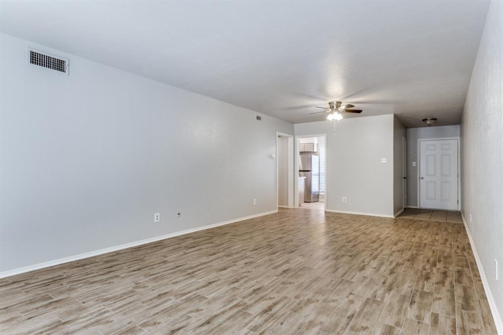 4022 Ridglea Country Club Drive, Unit 608 Fort Worth, TX 76126 - Photo 8 of 28 a view of an empty room with wooden floor