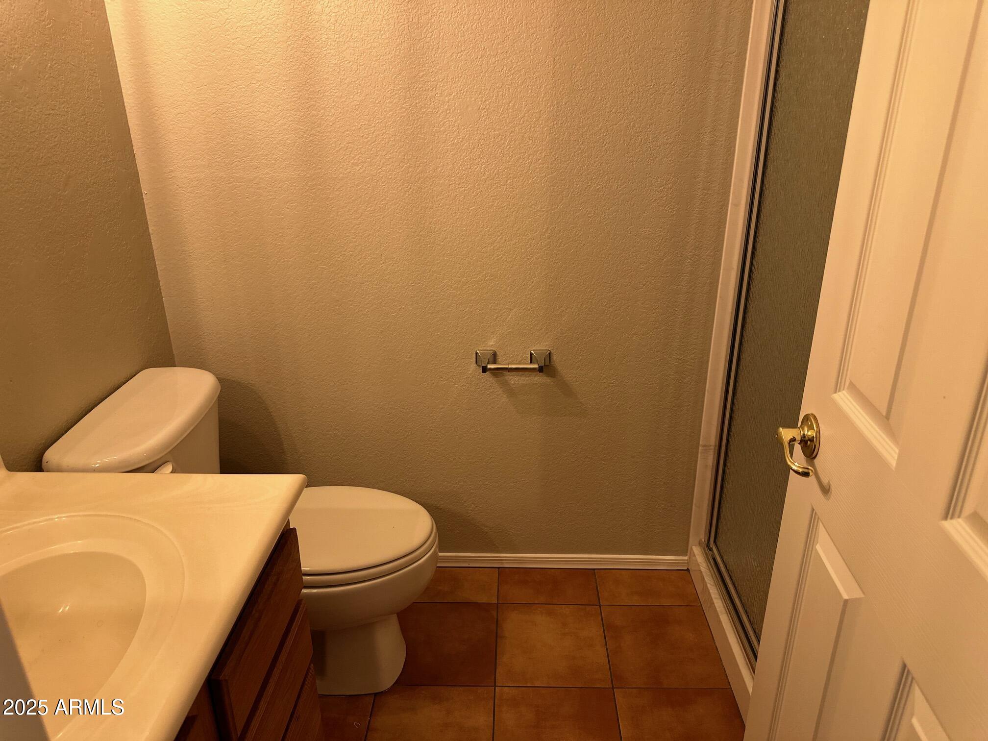 3491 North Arizona Avenue, Unit 20 Chandler, AZ 85225 - Photo 11 of 13 a bathroom with a toilet and a shower
