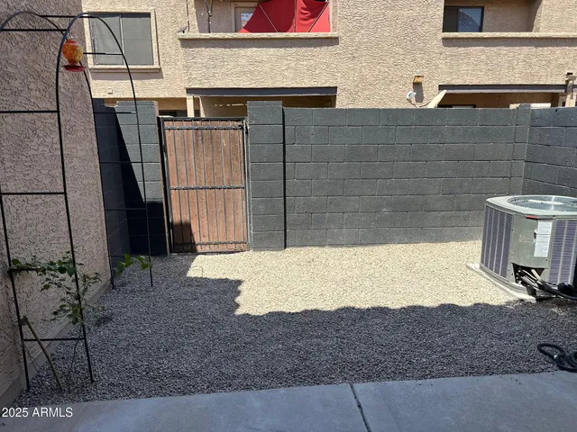 a view of a backyard with tub