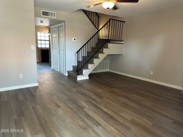 a view of an entryway with wooden floor
