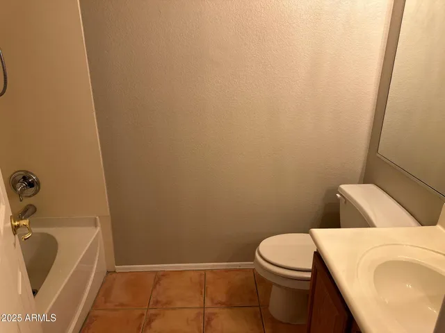 a bathroom with a sink and toilet