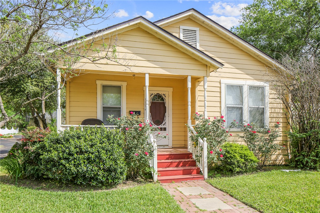 1112 South Baker Avenue Bryan, TX 77803 - Photo 1 of 1 a front view of a house with a yard