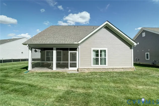 a view of a house with a yard and plants
