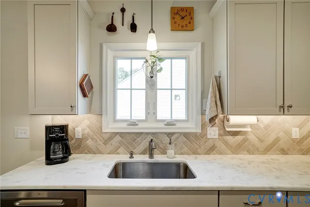 a kitchen with a sink and a window
