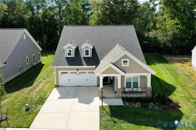 a aerial view of a house with a yard