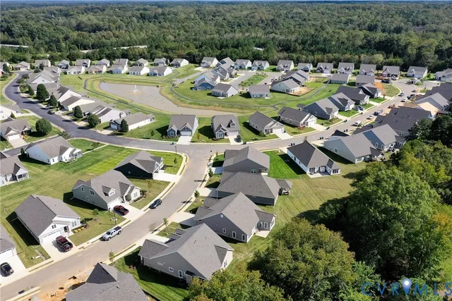 an aerial view of a house with a swimming pool