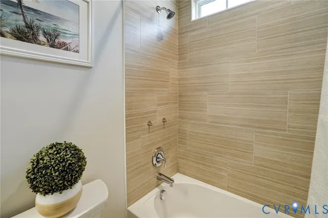 a bathroom with a toilet and a sink