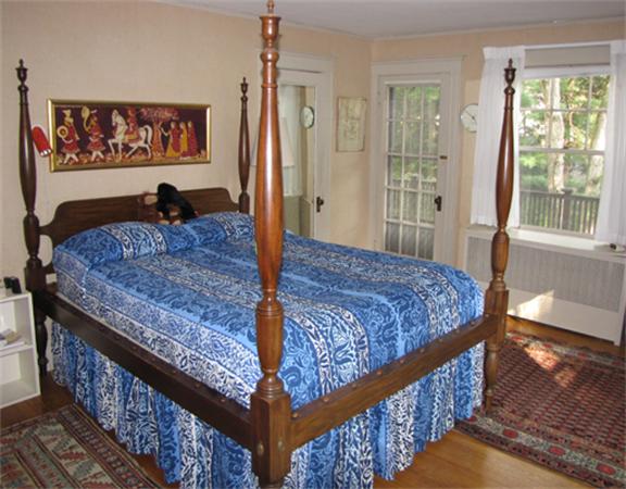 52 Livermore Road Wellesley, MA 02481 - Photo 4 of 9 a bed sitting in a bedroom next to a window