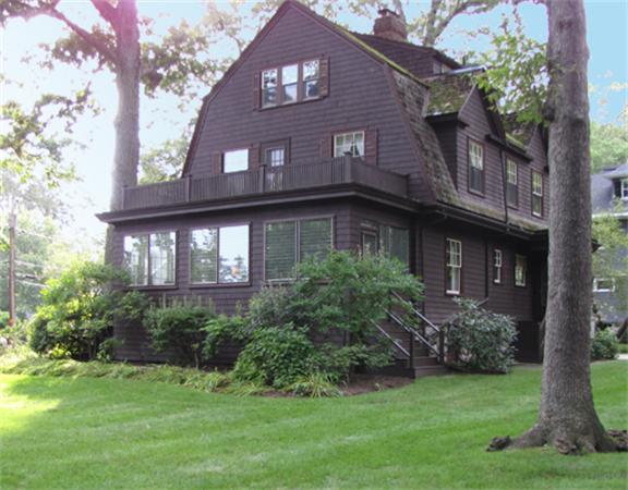 52 Livermore Road Wellesley, MA 02481 - Photo 8 of 9 a view of a brick house with a yard