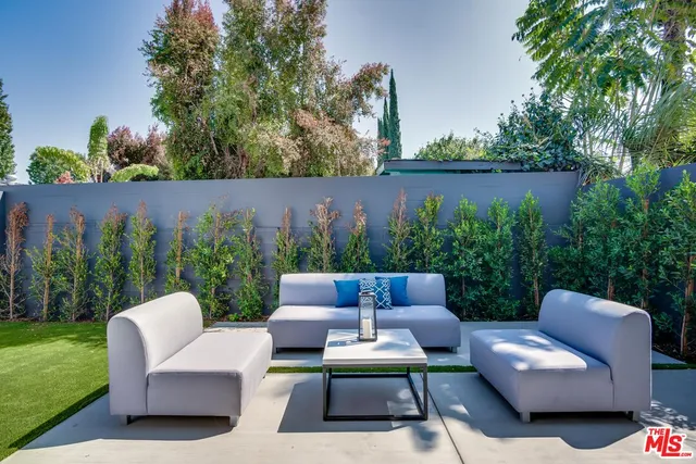 a view of a patio in the backyard