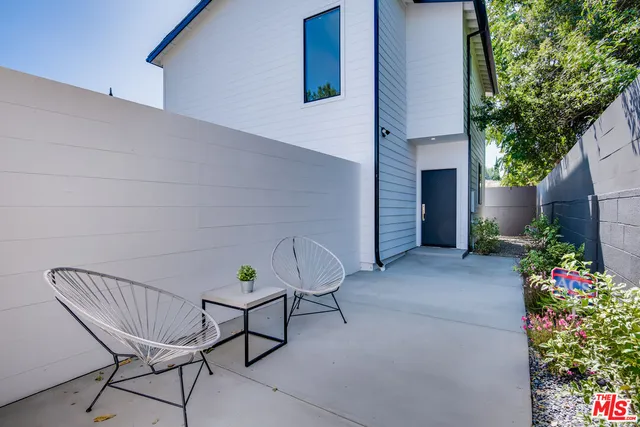 a view of a chairs in back of house