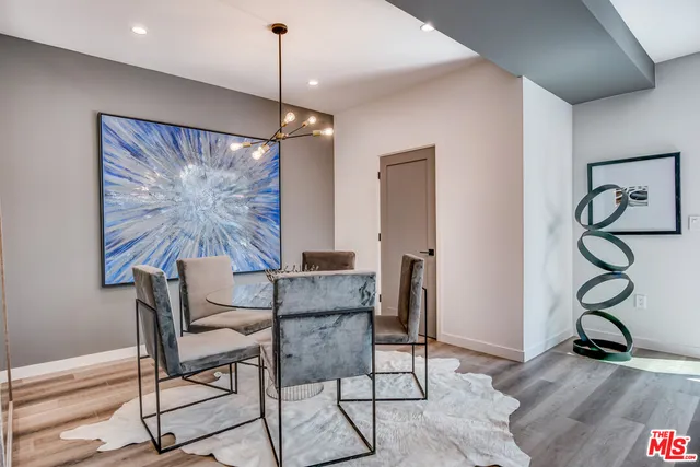 a view of a livingroom with furniture and a window