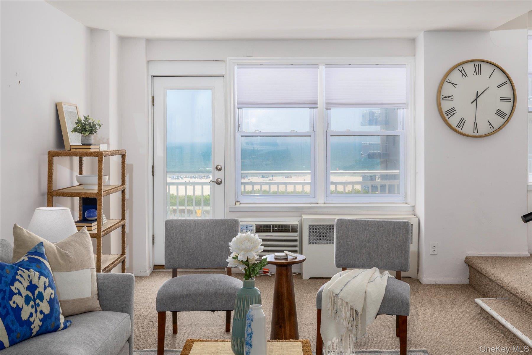 522 Shore Road, Unit 3W Long Beach, NY 11561 - Photo 1 of 1 a living room with furniture and a large window