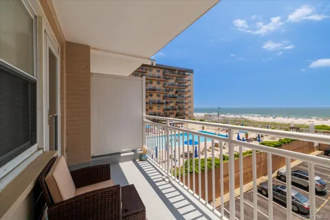 a view of balcony with furniture