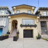 a front view of a house with a garage