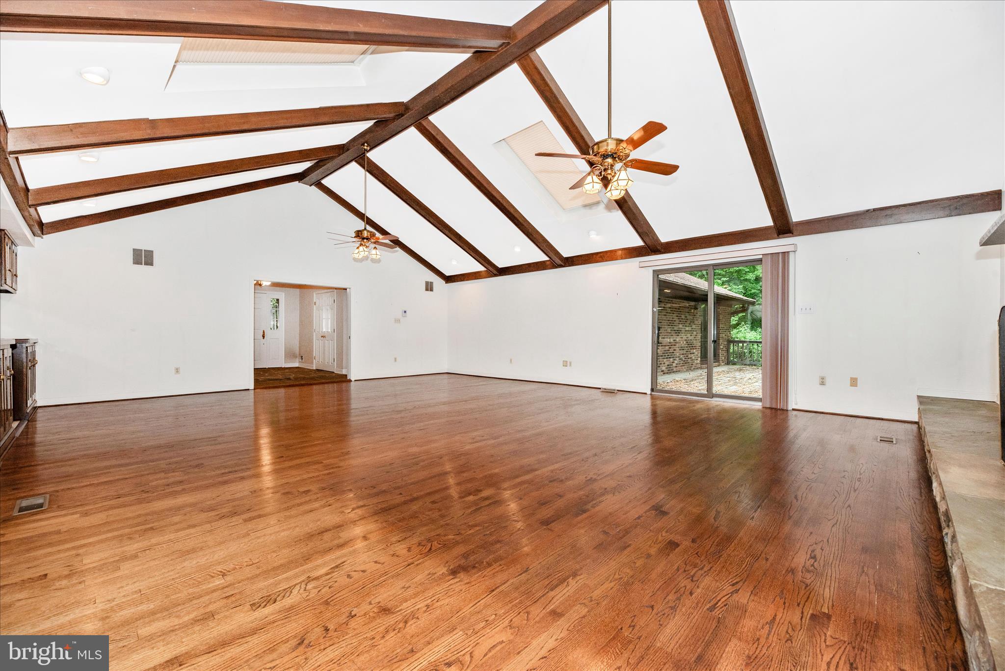 2221 Gold Mine Road Brookeville, MD 20833 - Photo 9 of 60 a view of an empty room with wooden floor and windows