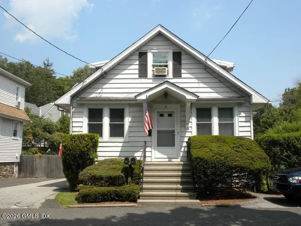 a front view of a house with a garage