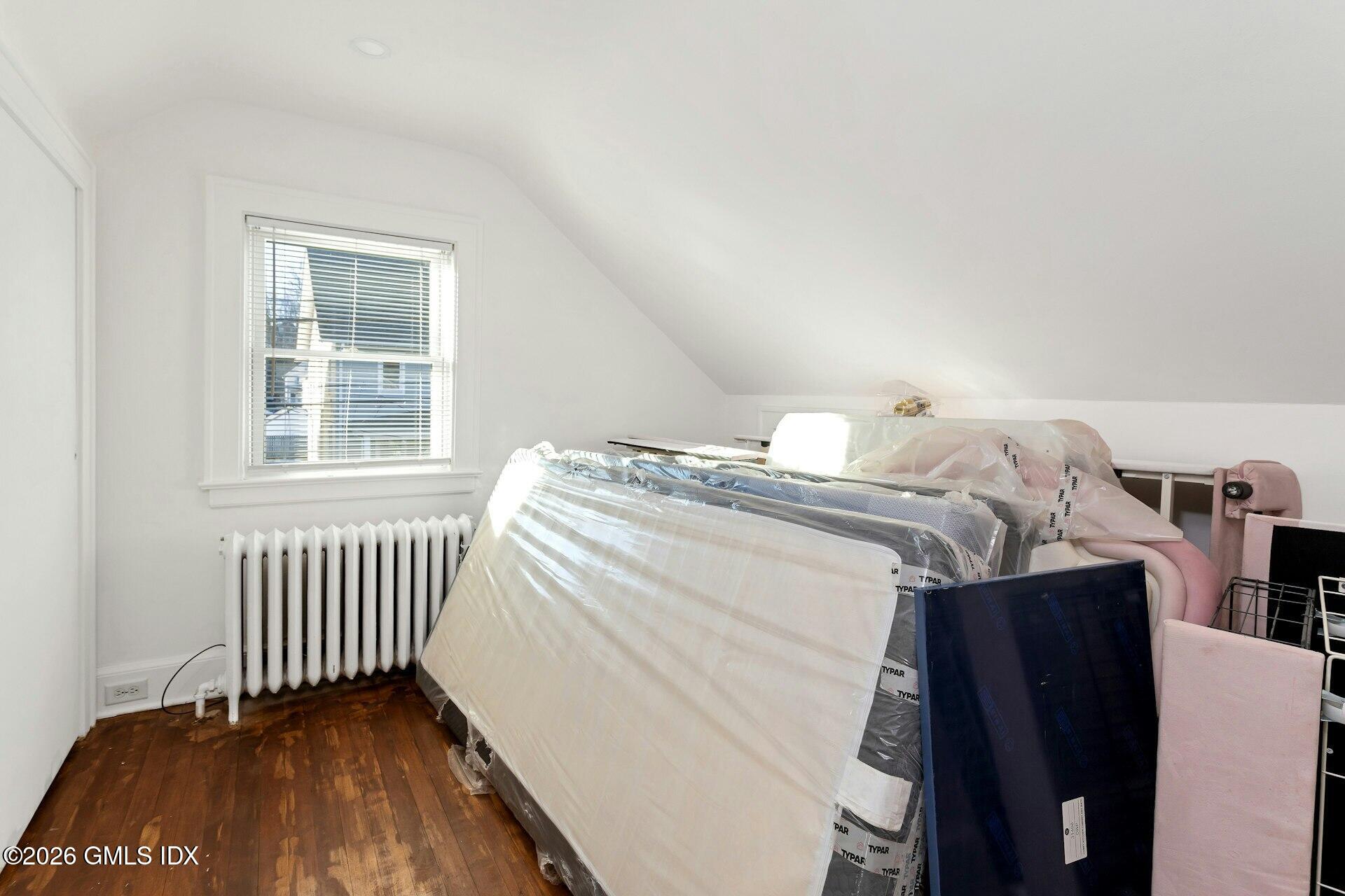 71 Prospect Street, Unit 2 Greenwich, CT 06830 - Photo 12 of 17 a bedroom with a bed and a window