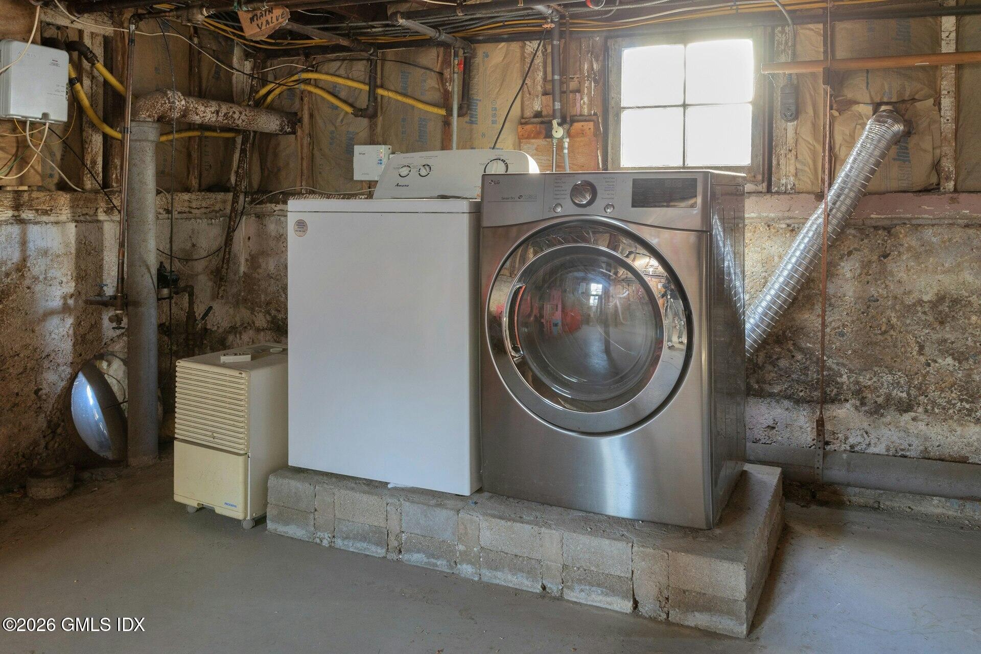 71 Prospect Street, Unit 2 Greenwich, CT 06830 - Photo 16 of 17 a utility room with dryer and washer