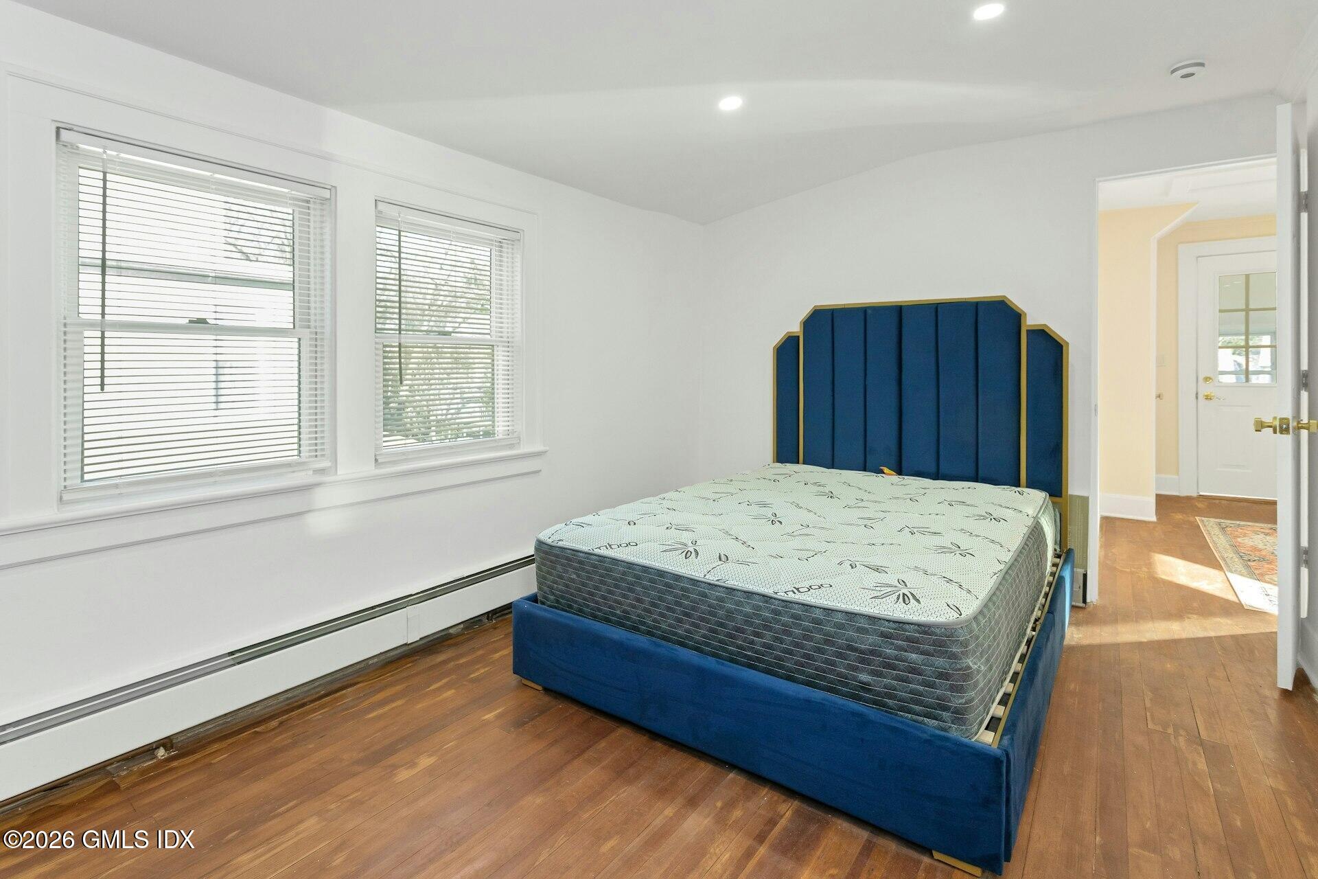 71 Prospect Street, Unit 2 Greenwich, CT 06830 - Photo 10 of 17 a bed sitting in a bedroom next to a window