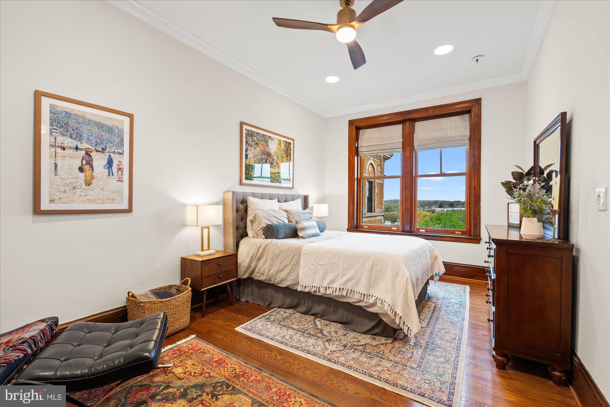 2853 Ontario Road Northwest, Unit 609 Washington, DC 20009 - Photo 12 of 14 a bedroom with a bed and wooden floor