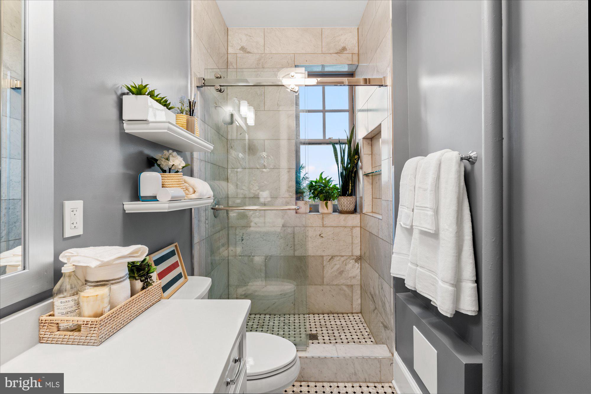 2853 Ontario Road Northwest, Unit 609 Washington, DC 20009 - Photo 14 of 14 a bathroom with a sink toilet and shower