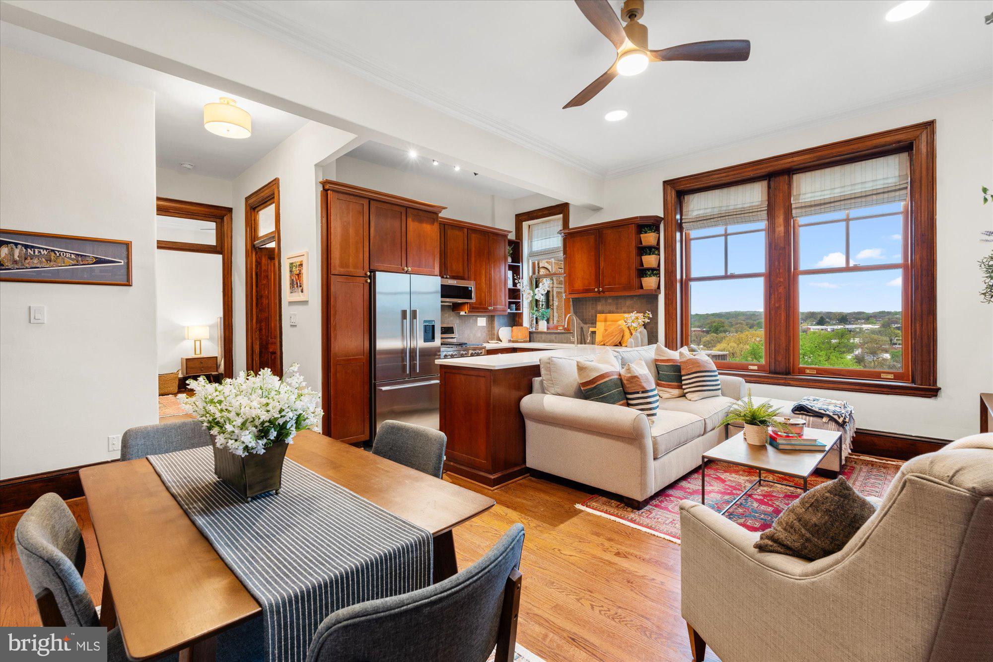 2853 Ontario Road Northwest, Unit 609 Washington, DC 20009 - Photo 3 of 14 a living room with furniture and a large window