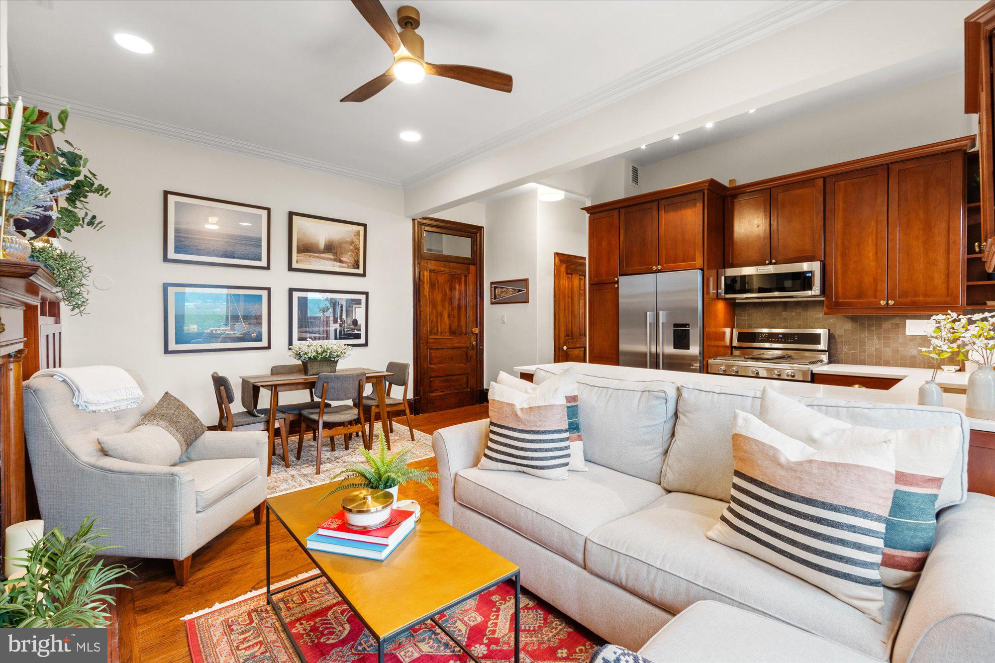 2853 Ontario Road Northwest, Unit 609 Washington, DC 20009 - Photo 4 of 14 a living room with fireplace furniture and a flat screen tv