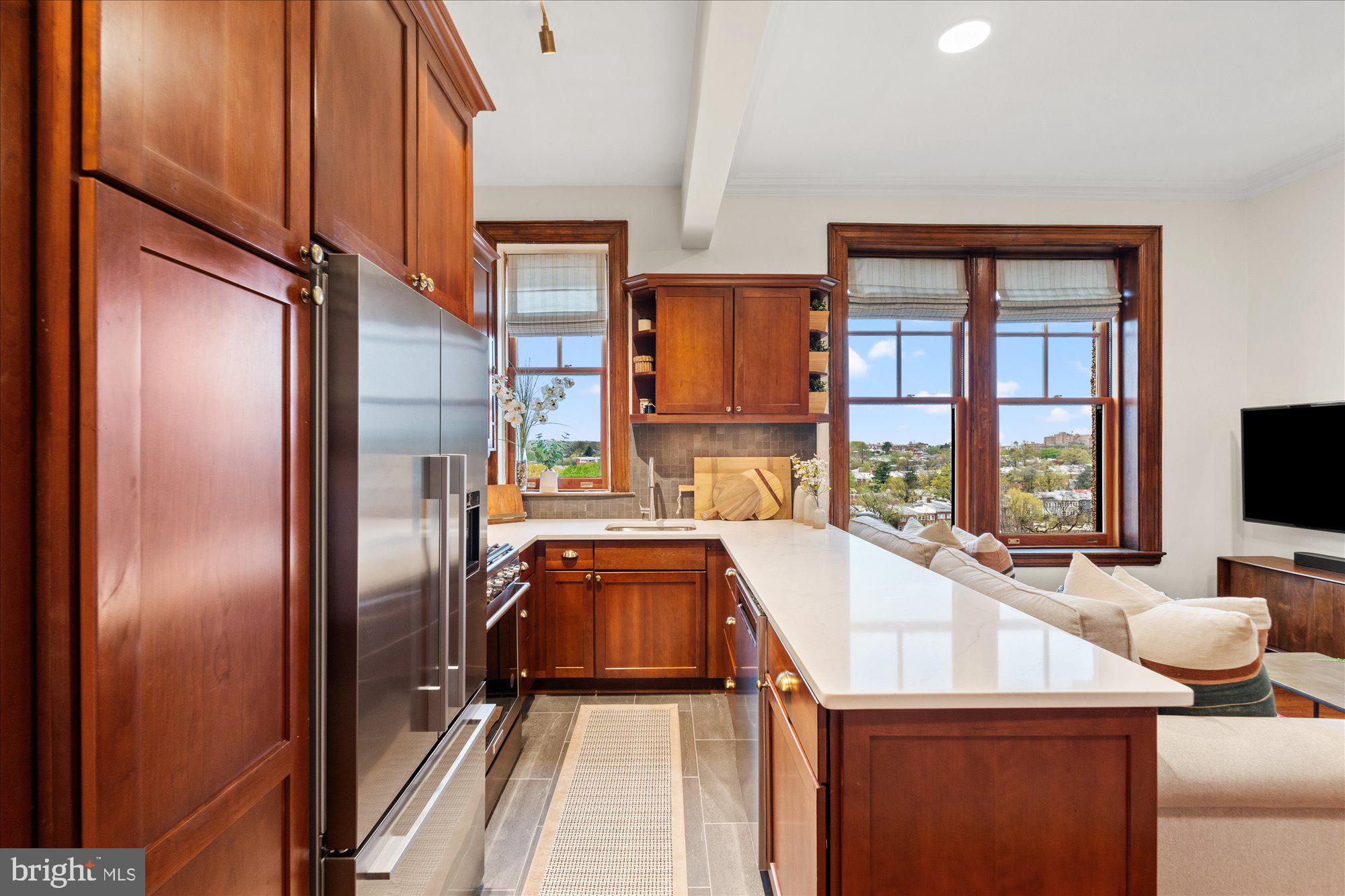 2853 Ontario Road Northwest, Unit 609 Washington, DC 20009 - Photo 7 of 14 a kitchen with a refrigerator and a sink