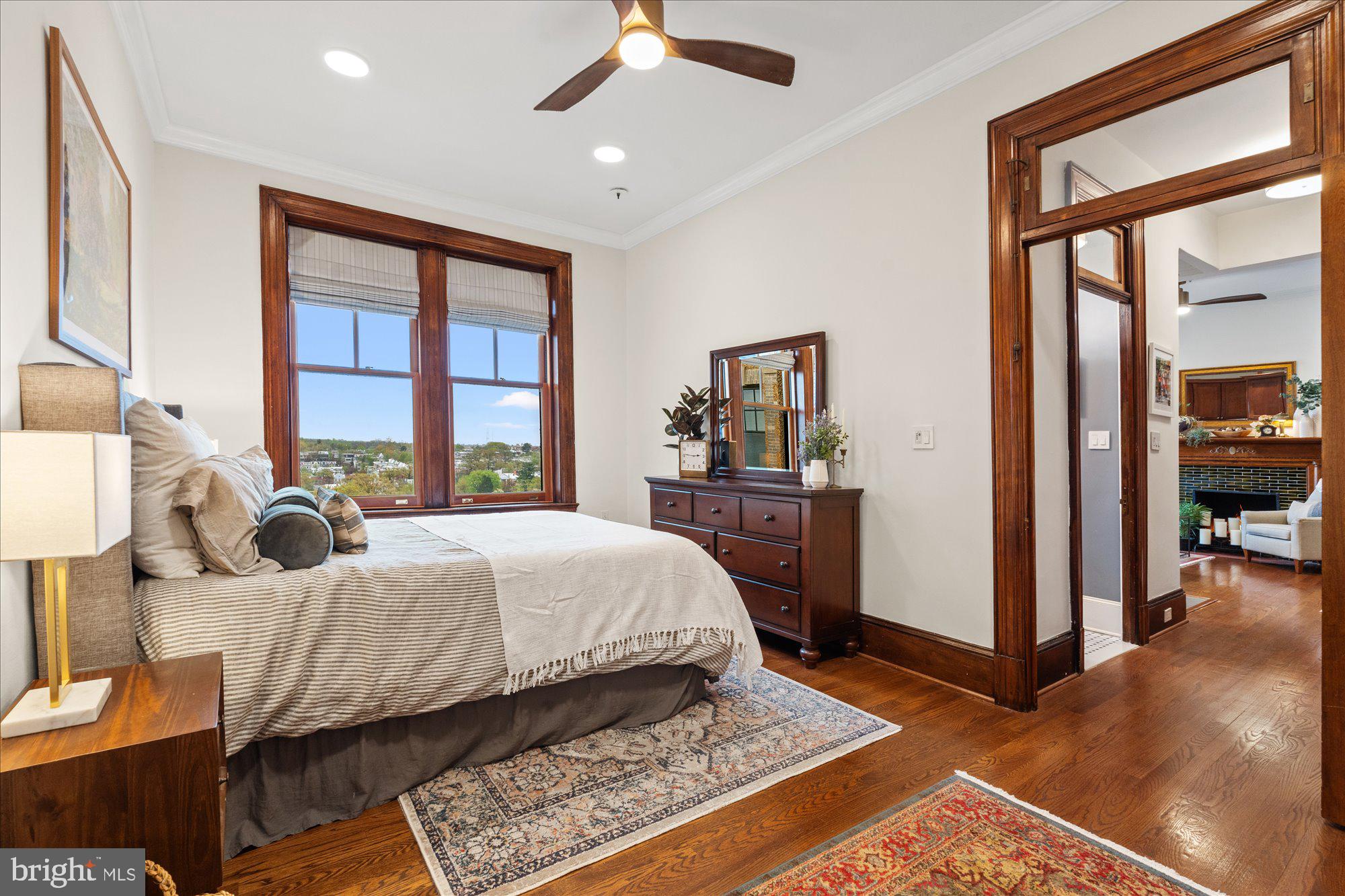 2853 Ontario Road Northwest, Unit 609 Washington, DC 20009 - Photo 9 of 14 a bed room with a bed and a window
