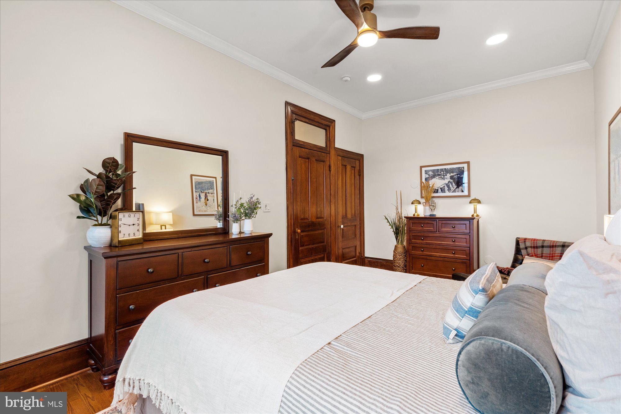 2853 Ontario Road Northwest, Unit 609 Washington, DC 20009 - Photo 10 of 14 a bedroom with a bed and a dresser