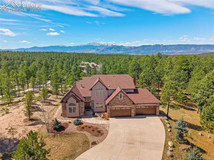 a aerial view of a house with a big yard