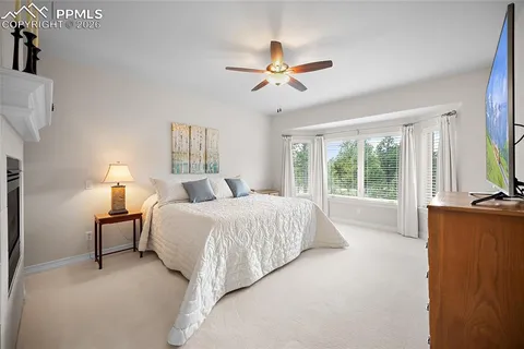 a bed room with a bed and a chandelier
