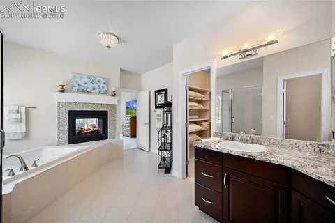 a bathroom with a sink double vanity and a mirror