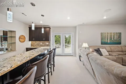 a living room with granite countertop furniture and a large window